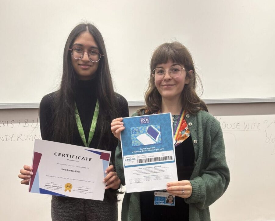 Sara Kundun Khan with her certificate for winning the Cambridge HE+ competition